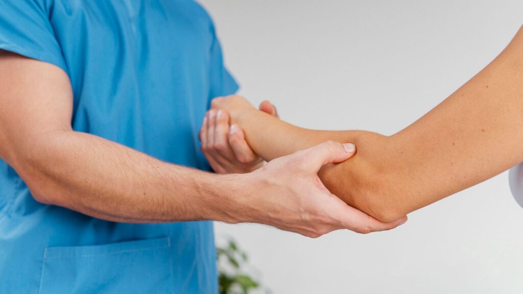Arthritis Treatment Cost in Kozhikode showing specialist examining patient joint during consultation